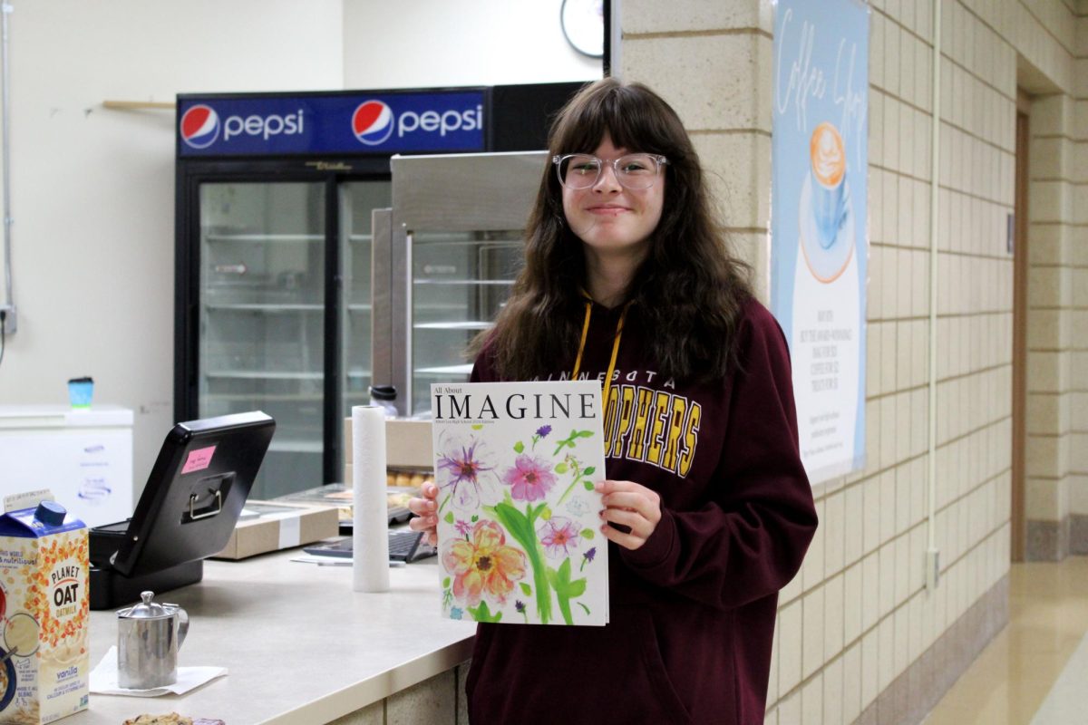 Gaby Tufte (10) picks up her I-mag at the concessions stand on May 8th. 
