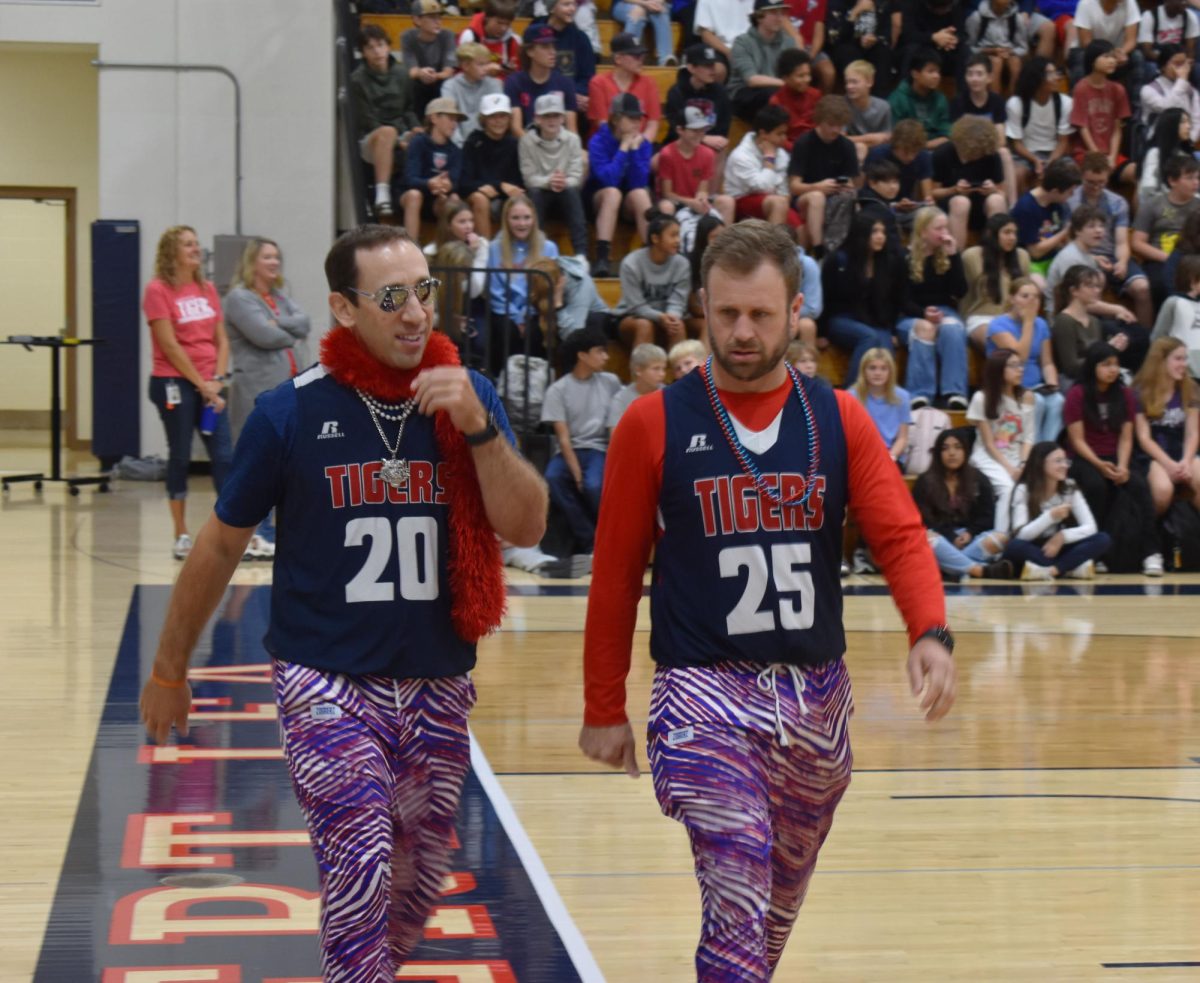 Teachers Zach Luther and Steve Alfred in cherry and blue for Friday's dress up day. 