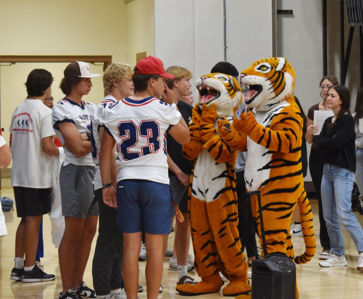 ALHS sports captains and school mascots.