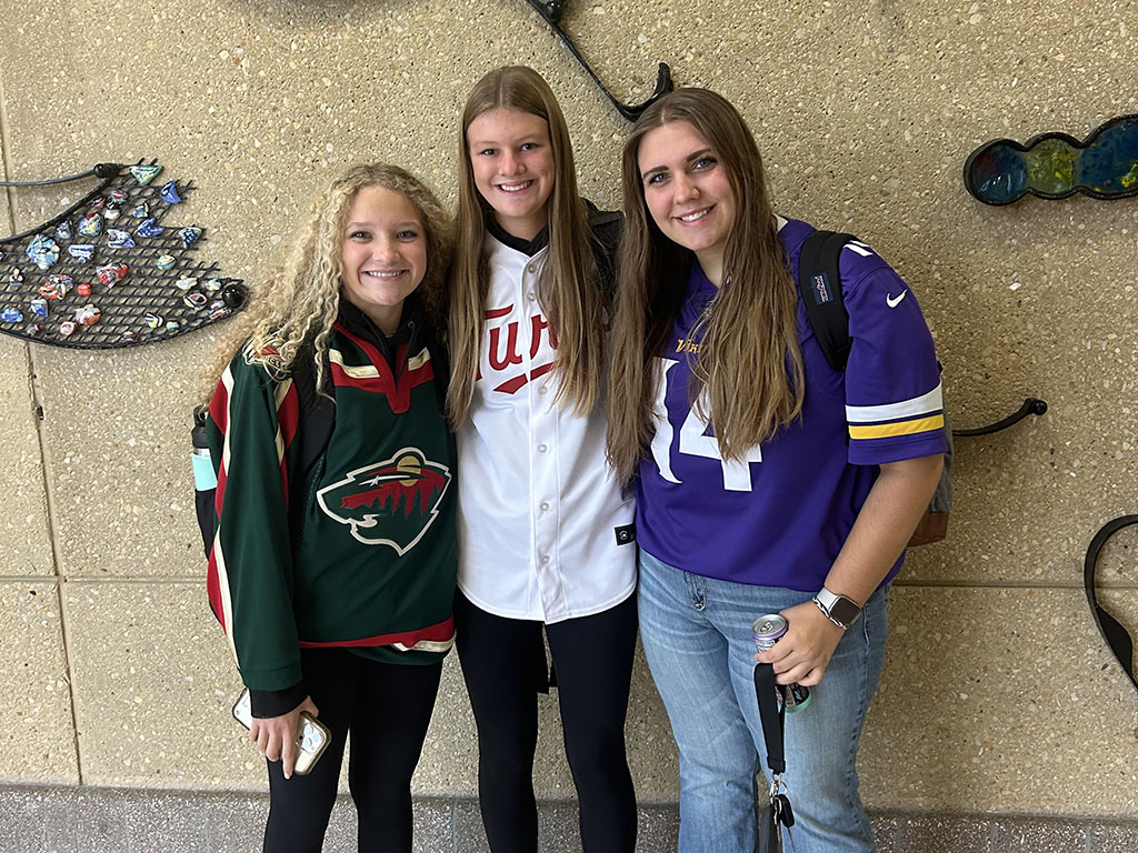 Mia Thompson (11), Taylor Johnson (11), Haylee Charley (11) wearing their jerseys on jersey day on Sept. 24. 