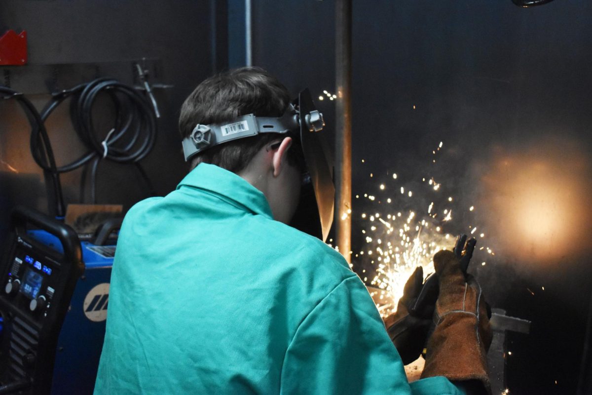 Tyler Youlden (12) works on one of his CIS welding projects.