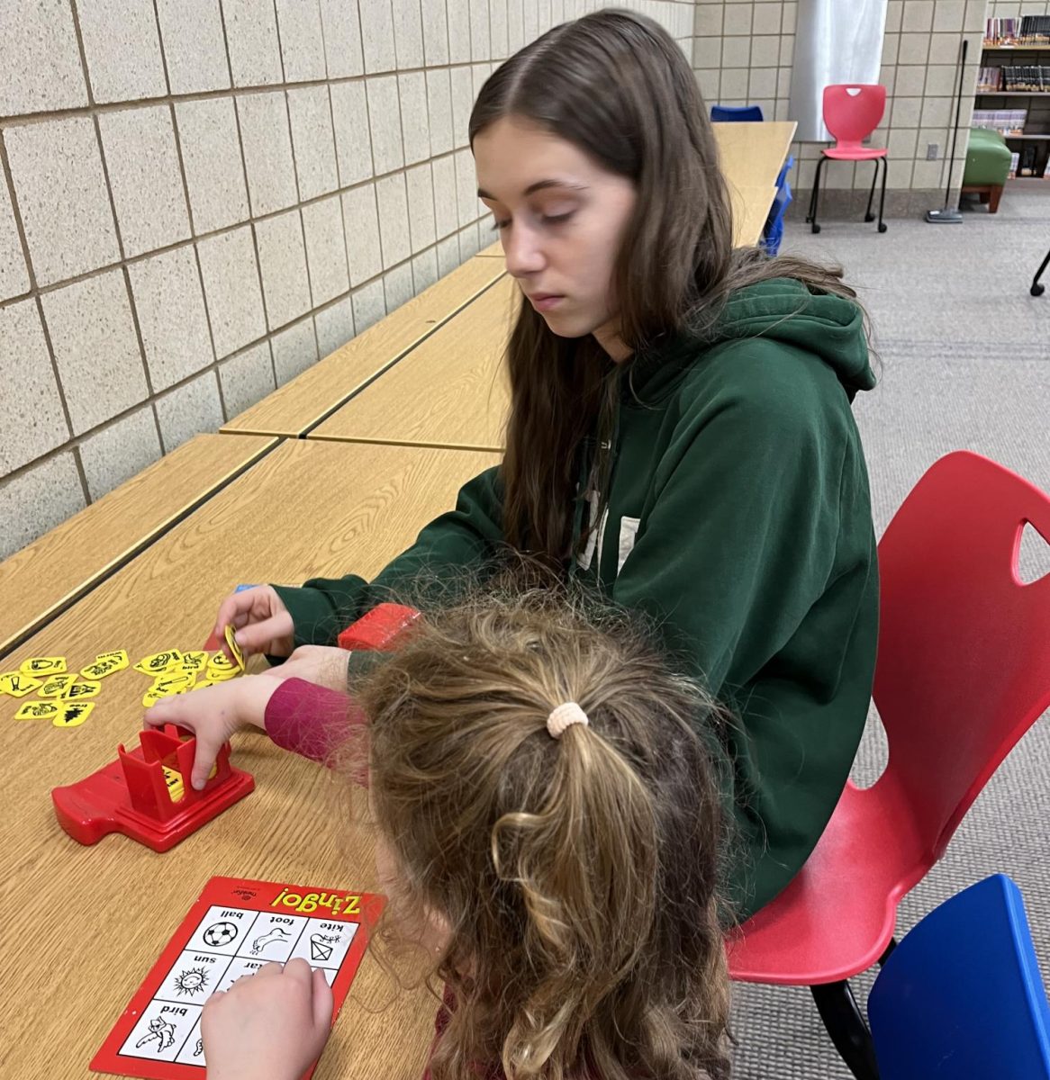 The National Honor Society, including Callie Brownlee (12), hosted an in-school daycare option for teaching staff during school confrences on Nov. 4 from 11 a.m.-7 p.m.