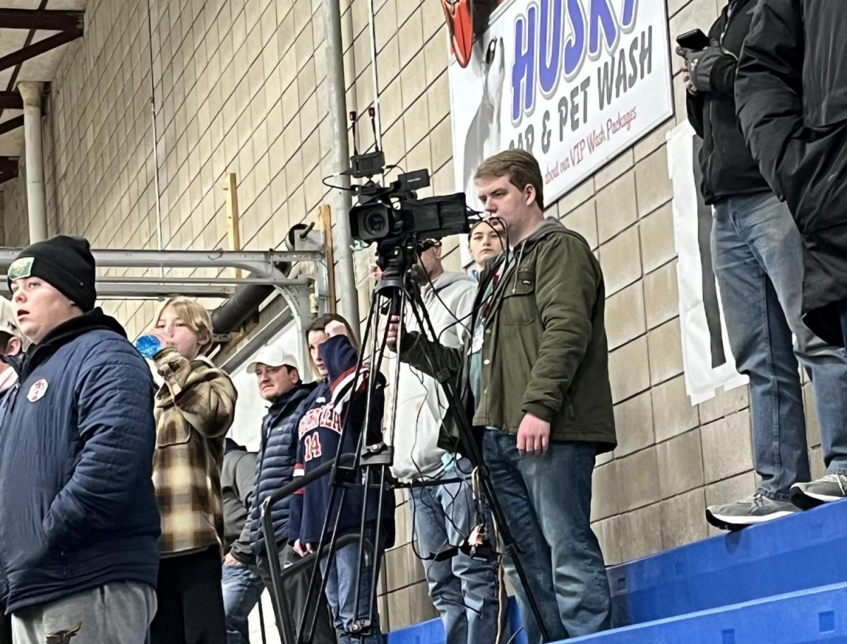 Junior Jonathan Streckert broadcasting for Albert Lea Live